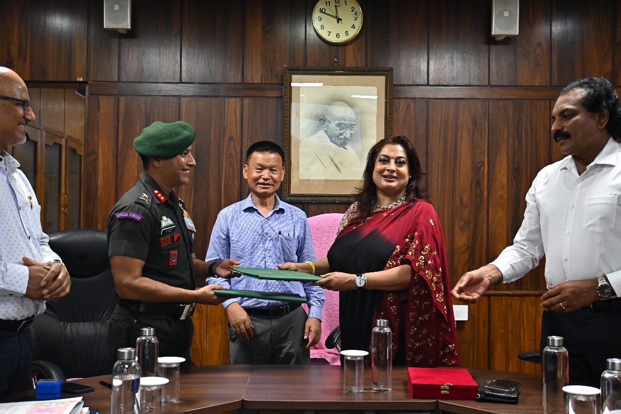 Indian Army officer and officials from BSI and ZSI exchanging documents in a formal meeting